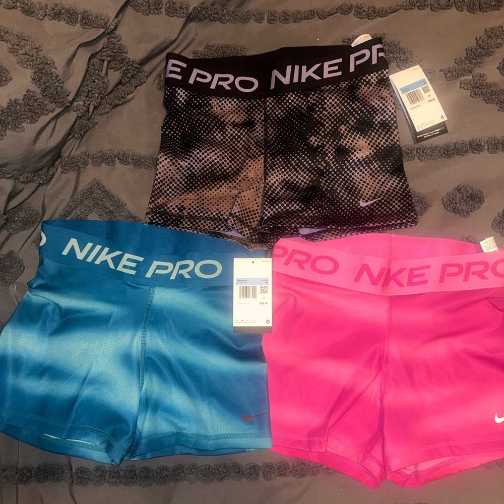 Nike Pro Women’s Shorts - Black, Blue, and Pink Trio